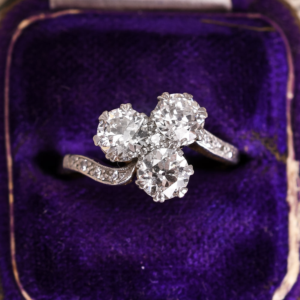 Art Nouveau Three-Stone Diamond Crossover Engagement Ring