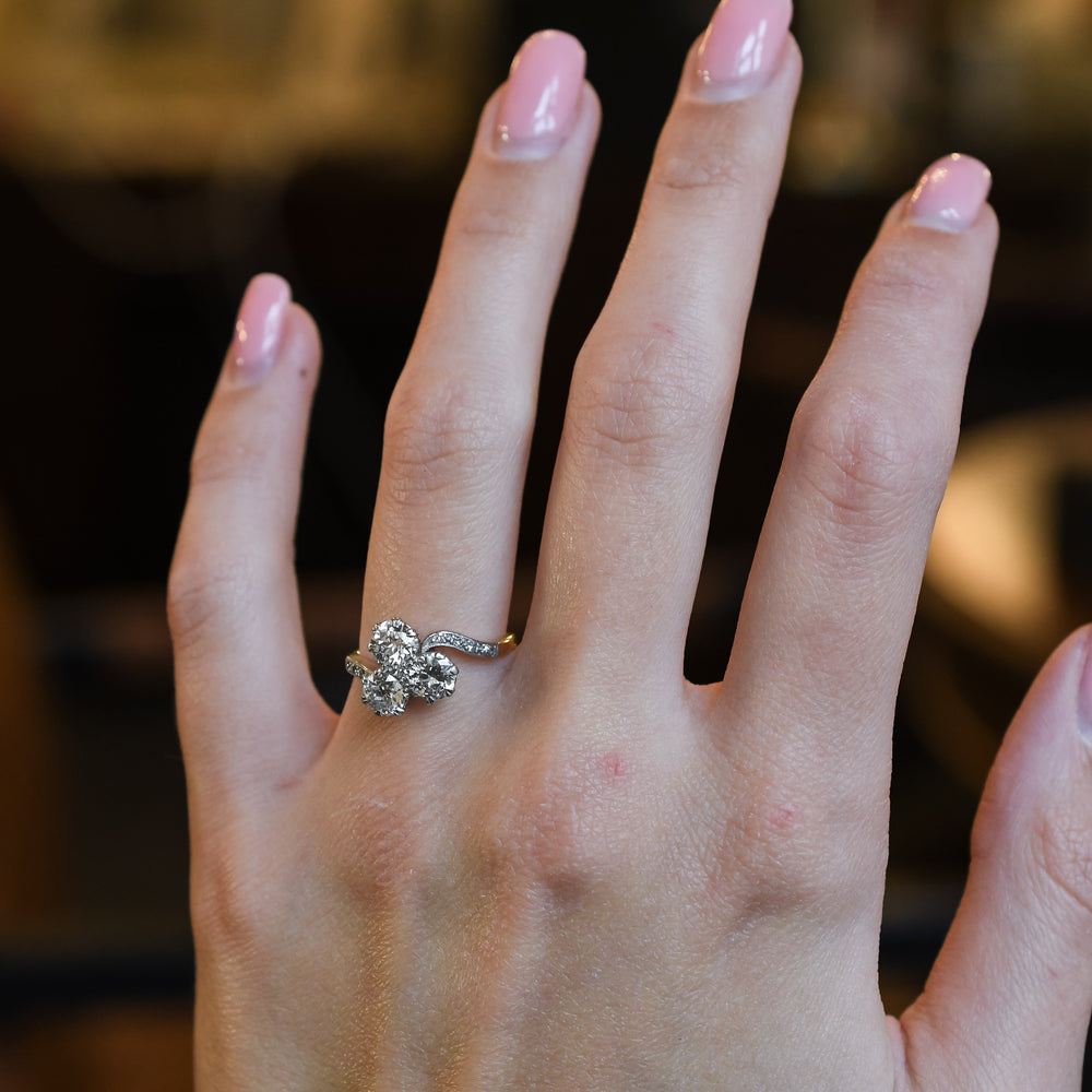Art Nouveau Three-Stone Diamond Crossover Engagement Ring