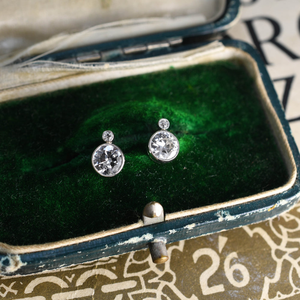Antique Platinum 1.6 carat Edwardian Bezel set diamond earrings.