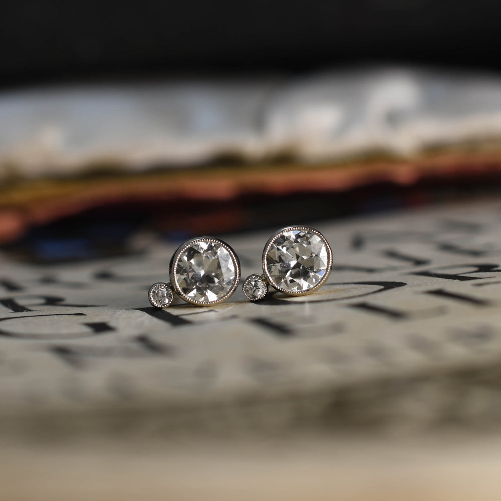 Antique Platinum 1.6 carat Edwardian Bezel set diamond earrings.