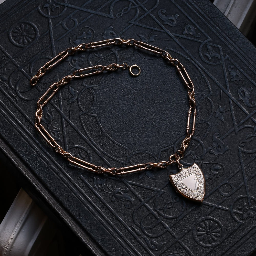 Edwardian Gold Shield Locket on Trombone Link Chain