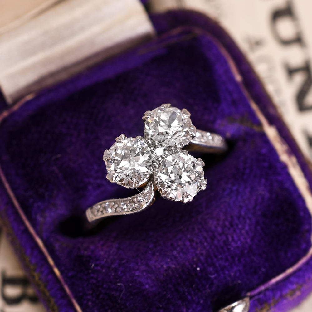 Art Nouveau Three-Stone Diamond Crossover Engagement Ring
