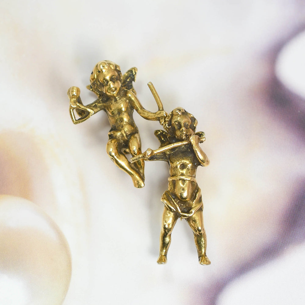 Victorian Brass Cherub Brooch Pair