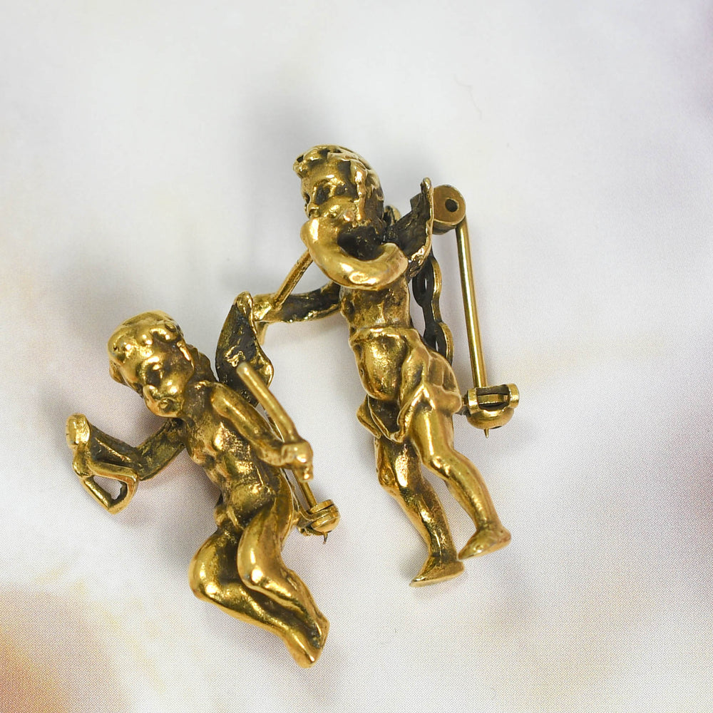 Victorian Brass Cherub Brooch Pair
