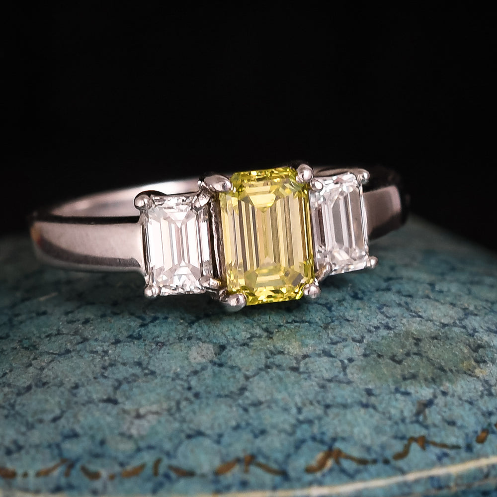 Contemporary Fancy Vivid Yellow Emerald Cut Diamond Trilogy Ring